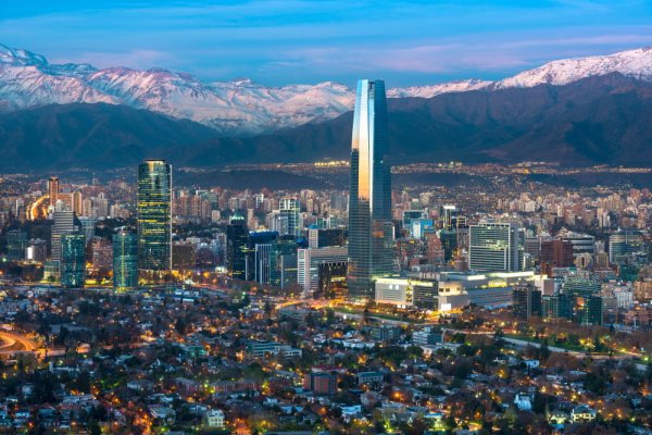 Santiago’s modern skyline, accentuated by the Andes NZ to South America Santiagos modern skyline accentuated by the Andes
